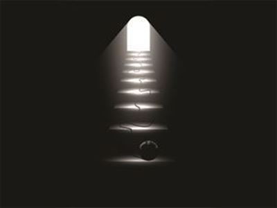 	Dark stairway with light at the end and ball