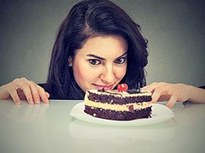 Lady staring at cake